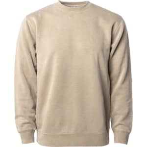A unisex crew fleece in a light beige pigment dye colour, featuring long sleeves and a round neck. It has a logo.