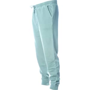 A pair of light blue pigment dye sweatpants featuring a drawstring and side pockets.