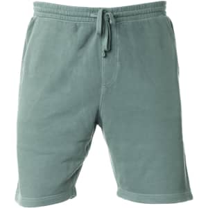 A pair of men's sweatshorts in a muted green pigment dye, featuring an elastic waistband and drawstring.