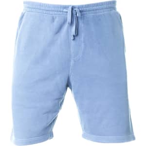A pair of light blue pigment dye sweatshorts with an elastic waistband and drawstring. Features a logo.