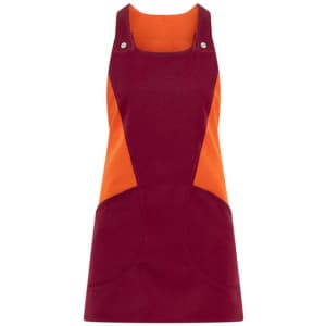 A maroon and orange Levante apron with a pinafore design, featuring two front pockets and snap buttons.