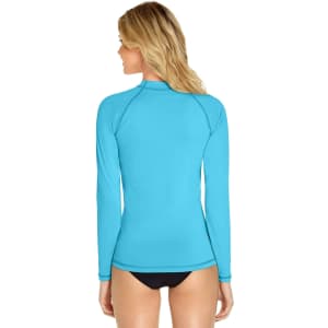 A long sleeve rashie in bright blue, featuring a fitted design and a logo on the back.