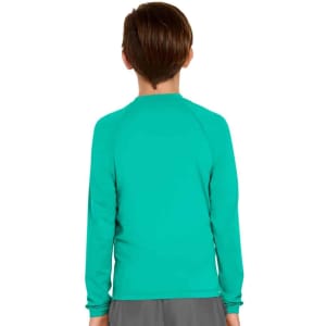 A youth long sleeve rashie in vibrant turquoise with a simple design and a branding logo.