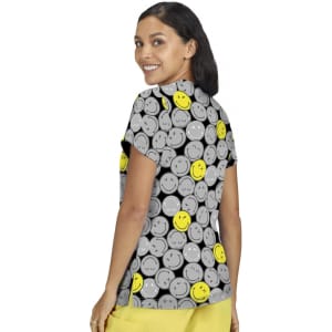 A short-sleeved women's top featuring a playful pattern of grey and yellow smiley faces, with a logo prominently displayed.