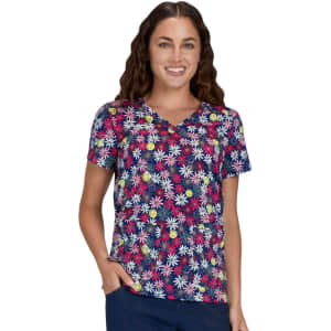 A floral print top featuring a navy background with multi-coloured flowers. The model is smiling and wearing the shirt.