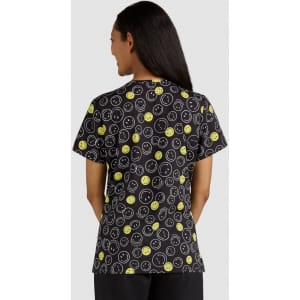 A T-shirt featuring a black background with vibrant yellow and white smiley face patterns. It has a logo on the back.