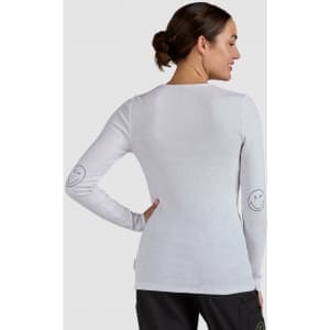 A long-sleeve white top featuring smiley faces on the sleeves, with a fitted design and a subtle texture.