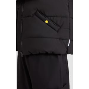 A black puffer vest with a side pocket and a yellow button detail, featuring a zip closure on one side.