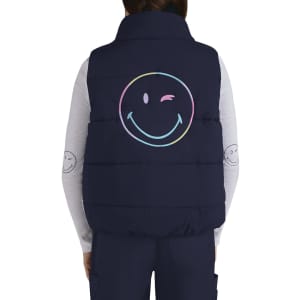 A navy vest with a large pastel smiley face graphic on the back. It features a collar and is quilted.