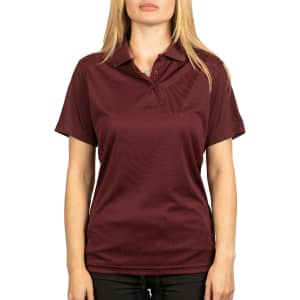 A maroon polyester sport shirt with a collar and a logo on the chest, modelled by a woman.