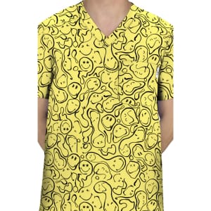 A yellow scrub top featuring a playful, abstract pattern with various shapes and lines, accentuated with black outlines.