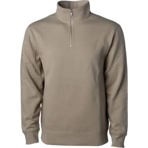 A midweight quarter zip pullover in a muted beige colour. The design features a zip at the neck and long sleeves.