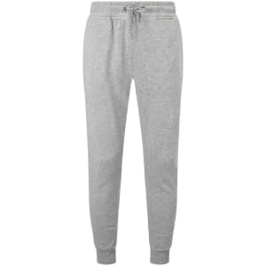 Fitted joggers in a light grey colour, featuring an elastic waistband and cuffs. Includes a branded logo.