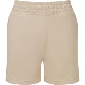 Beige jogger shorts featuring an elastic waistband and a simple design. Includes a logo on the waistband.