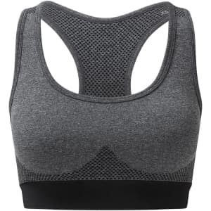 A seamless sports bra in grey with a mesh design and racerback style, featuring a black band at the bottom.