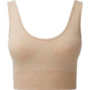 A ribbed, seamless sport bra in a light tan colour with a scoop neckline and thick straps, featuring a logo.