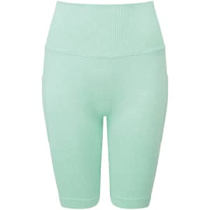 Mint green ribbed seamless cycle shorts featuring a high waistband and pockets on the sides.