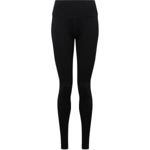 A pair of black seamless leggings with a high waist and fitted design, featuring a logo on the waistband.