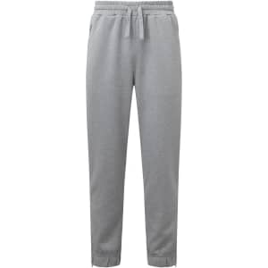A pair of grey joggers featuring an elastic waistband and drawstring, styled for comfort. Logo present.