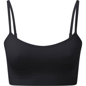 A black seamless sport bra with thin straps and a fitted design. It features a branding logo on the front.