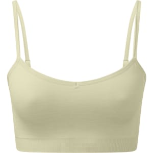 A light yellow, seamless sports bra with thin straps and a fitted design. It features a logo on the side.