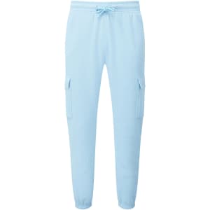 Light blue unisex cargo joggers with side pockets and elastic cuffs. Features a drawstring waistband and a logo.