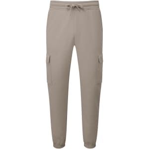 Unisex cargo joggers in beige featuring side pockets and an elastic waistband. Includes a logo on the fabric.