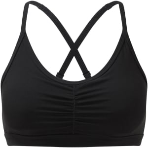 A black ruched sports bra with a cross-back design and a smooth, fitted appearance. It features a small logo.