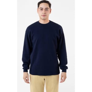 A navy blue heavy thermal crewneck jumper with long sleeves and a relaxed fit, featuring a subtle logo.