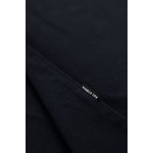 A navy T-shirt featuring a small tag, with a logo visible on the hem.