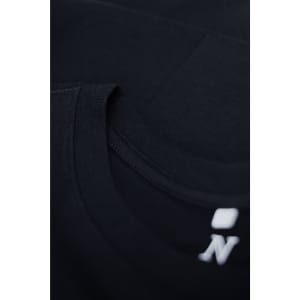 A black T-shirt featuring a crew neck design and a small logo on the neckline.