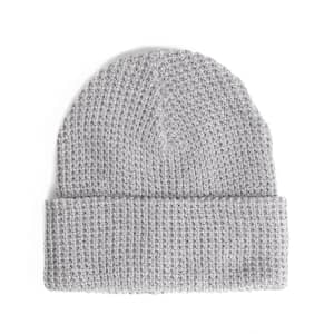 A grey waffle knit beanie with a folded cuff and textured pattern, featuring a small logo.