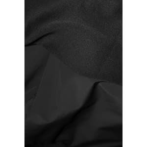 A hybrid jacket featuring a mix of textured and smooth black fabric, with a logo present on the product.