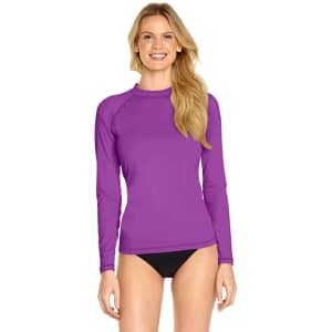 A long sleeve rash shirt in vibrant purple, featuring a fitted design and a round neckline, suitable for adults.