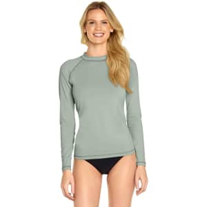 A light green long sleeve rashie with a fitted design, featuring a logo on the front.
