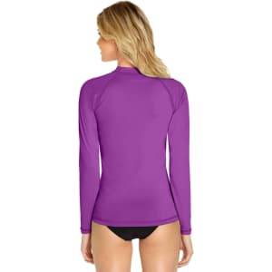 A long sleeve rashie in vibrant purple with a fitted design, featuring a logo on the back.