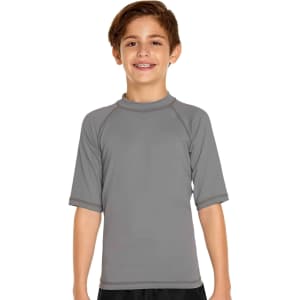 A youth short sleeve rashie in grey with a fitted design and a logo on the chest.