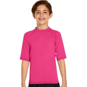 A pink youth short sleeve rashie with a collar. It features a logo on the chest and is made for sun protection.