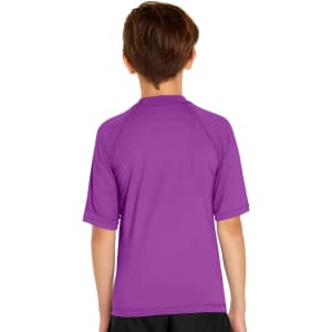 A purple youth short sleeve rashie featuring a back view, made for sun protection with UPF 50+.