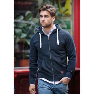 A navy hooded jacket with a zip and front pockets, featuring a logo, worn by a man walking outdoors.