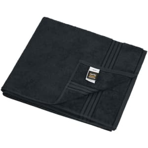 A black sauna sheet folded neatly, featuring a textured surface and a label.
