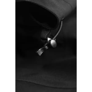 A close-up of a black Yosemite Shell Jacket featuring a zip and fabric details. The jacket includes a logo.