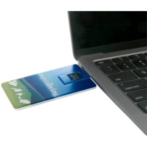 A slim, blue credit card-sized Type-C flash drive is connected to a laptop. It features a logo on its surface.