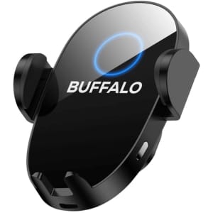 A black wireless car charger with a circular design and a logo. It features two side clips for securing devices.