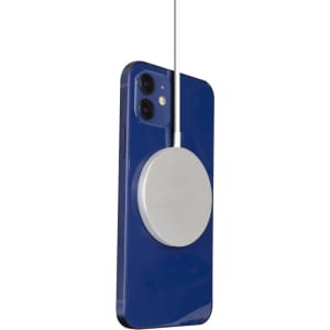 A magnetic wireless charger in silver attached to a blue smartphone. Features a sleek design with a charging cable.