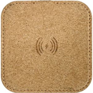 A square, natural cork wireless charger with a simple branding logo at the centre.