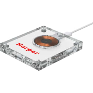 A clear acrylic wireless charger with a circular charging pad and a logo on its surface.