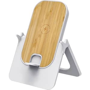A wireless charging stand in white with a bamboo top, featuring a logo on the surface.