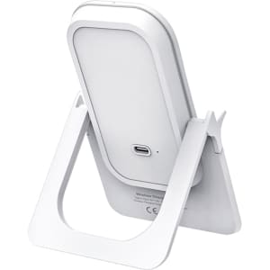 A white wireless charging stand with a sleek design, featuring a built-in stand and a USB-C port.