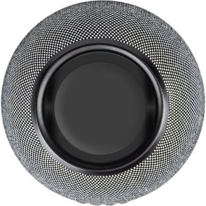 A spherical wireless charging speaker with a textured black and silver design, featuring a circular charging pad on top.